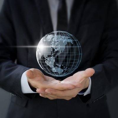Businessman holding 3d digital world map in hand